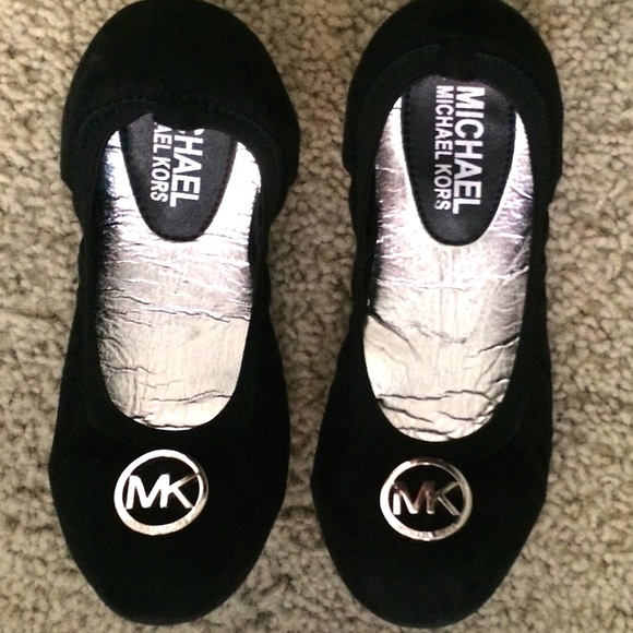 Michael Kors black ballet flats.