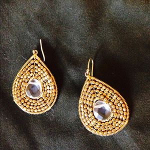 Gold tone and white stone earring