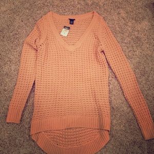 Knit sweater.