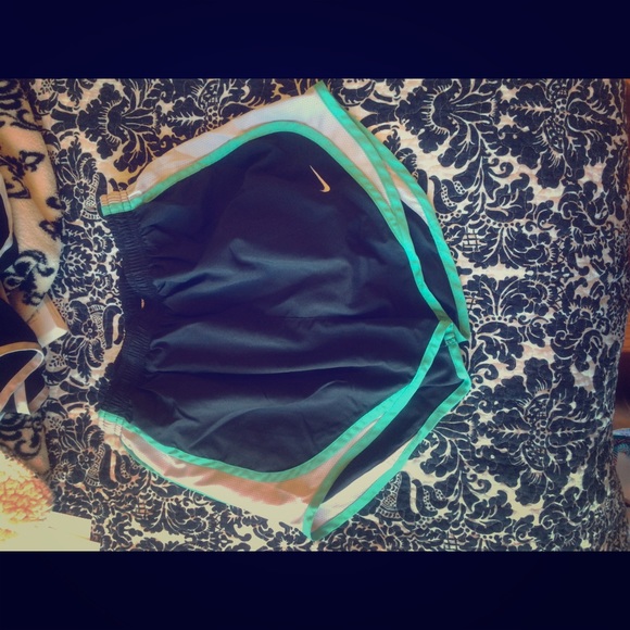 Dark grey Nike shorts with teal lining