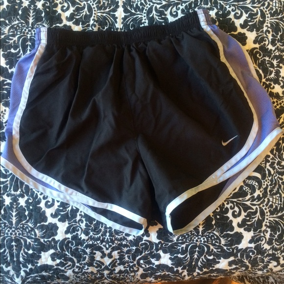 Black Nike shorts with soft purple filling