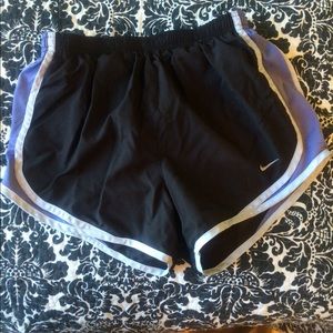 Black Nike shorts with soft purple filling
