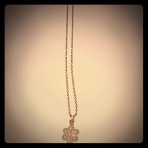 Pearl necklace with a gold chain.