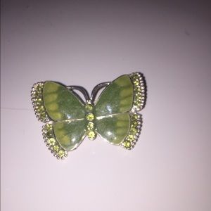 Green butterfly broach.