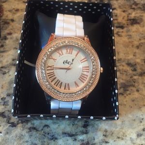 White banded, Gold and rhinestone accented watch