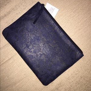 7 for all Mankind Navy snake print clutch.