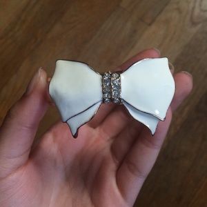 White bow, gold bracelet