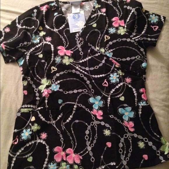 Brand new scrub top in S size