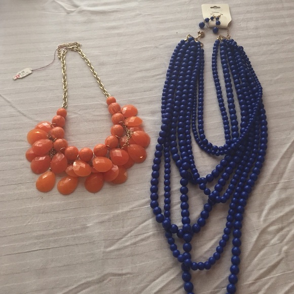 2 Statement necklaces, one with matching earrings.