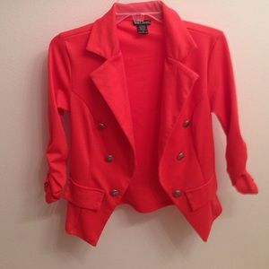 Orange blazer with gold buttons