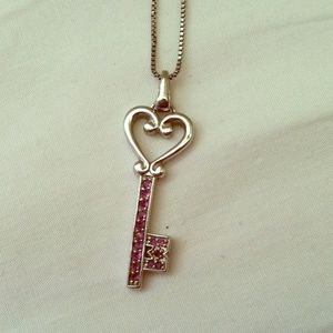 Purple jeweled key necklace