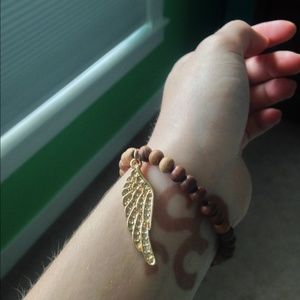 Wooden beaded bracelet with charm