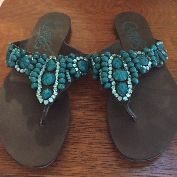 Carlos Santana sanders with jade colored stones.