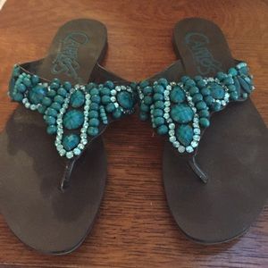 Carlos Santana sanders with jade colored stones.