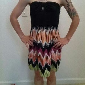 Dress with cut out bow in front