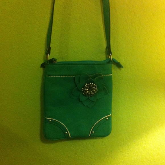 Blue sling over purse