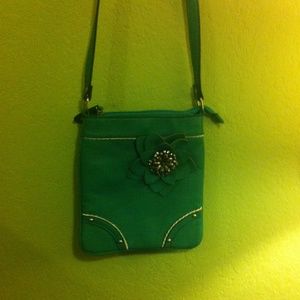 Blue sling over purse