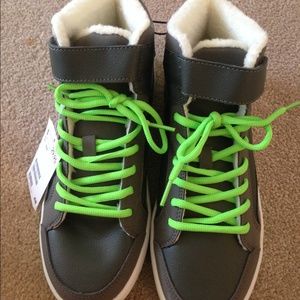 Little boy green shoes.