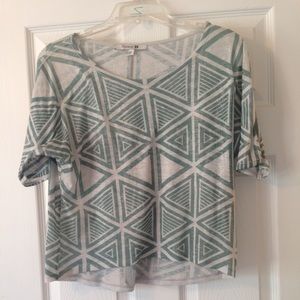 Teal and white geometric print top