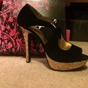 Gold and black platform heels