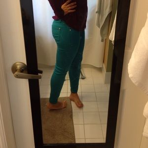 Turquoise jeggings.