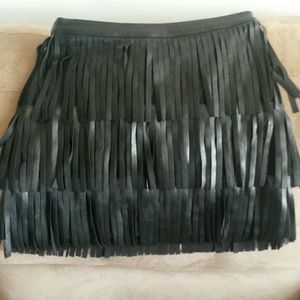 Stretchy leather tassle mini skirt.