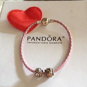 Pink Pandora bracelet with mom and heart charms.