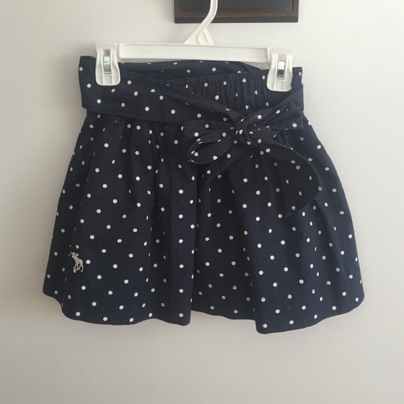 Navy polka dotted skirt