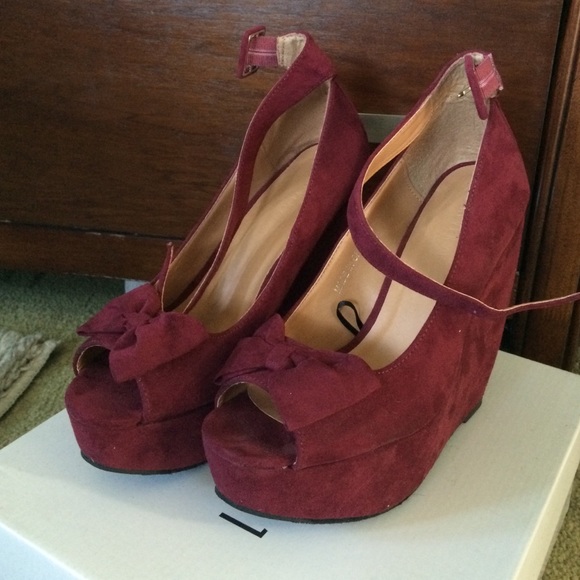 Burgundy open toe wedges.