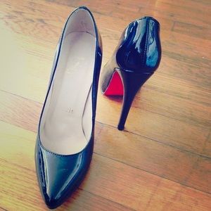 Christian Louboutins black patent leather pumps