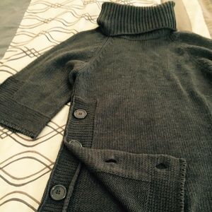 Bundled turtleneck sweater and striped turtleneck