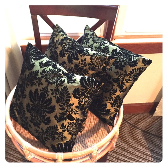 Three satin throw pillows w black velvet designs.