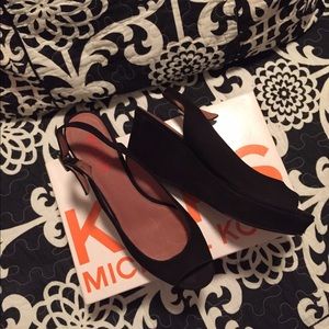 Authentic Michael Kors black all leather wedges