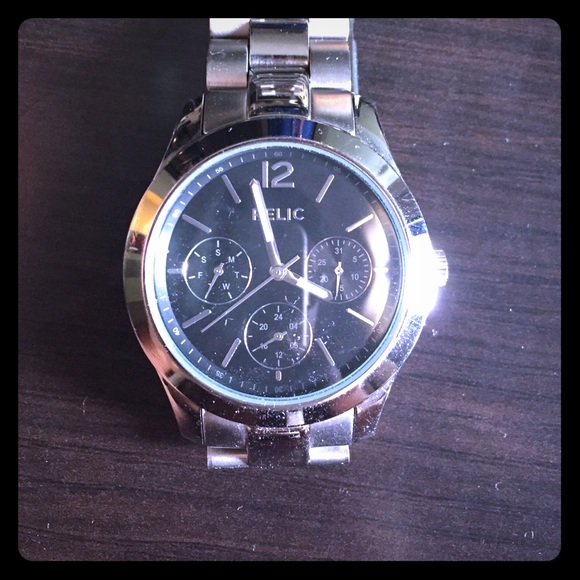 Relic silver metal bracelet blue face watch.