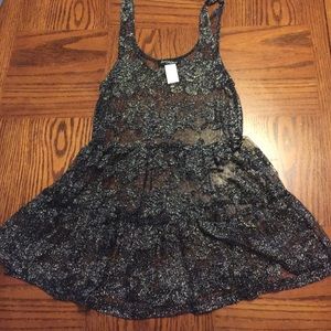 Over lay top. Super cute with tank and leggings.