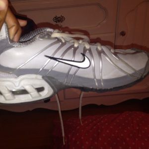 Grey and silver Nike Air shoes