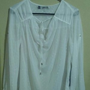 Jennifer Lopez long sleeve white top