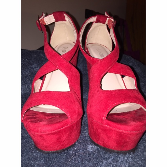 crossed red wedge heels