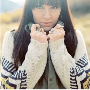 Large army jacket with sweater sleeves.