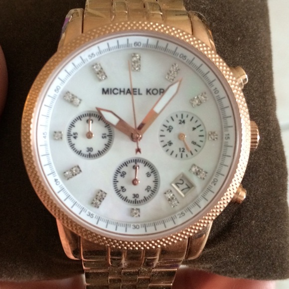 Michael kors rose gold watch with diamonds.