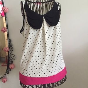 Cream polka dot top with collar and pink hem