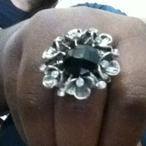 Silver and black flower ring.