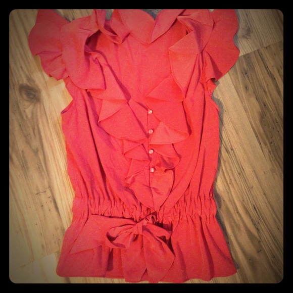 Ruffled, button, and tie shirt. Super cute.