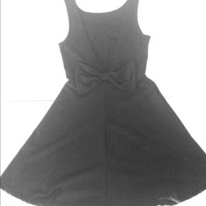 simple black dress with a bow on the back
