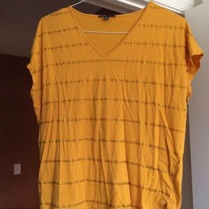 Bedazzled orangey yellow shirt