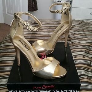 Gold heels with snake ankle detail