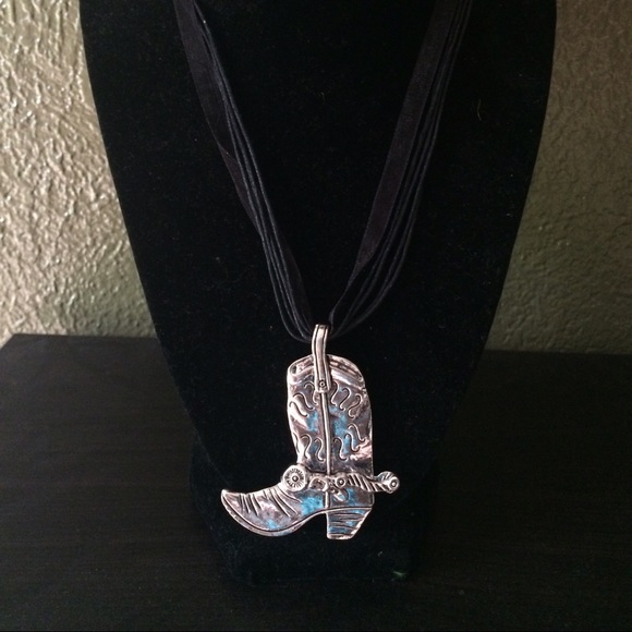 Cowboy boot necklace.