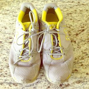 Grey and yellow Under Armour running shoes
