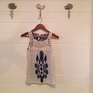 Sheer Sleeveless Blouse with Embroidered detail.