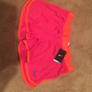 Neon colored Nike shorts. NWT